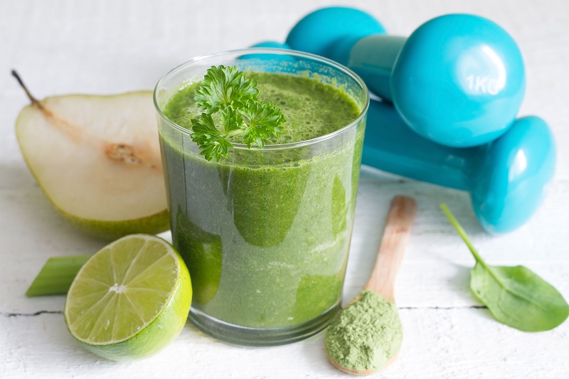 Pear fruit, lemon and full glass of green smoothi