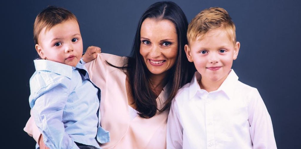 woman and two boys posing for a picture