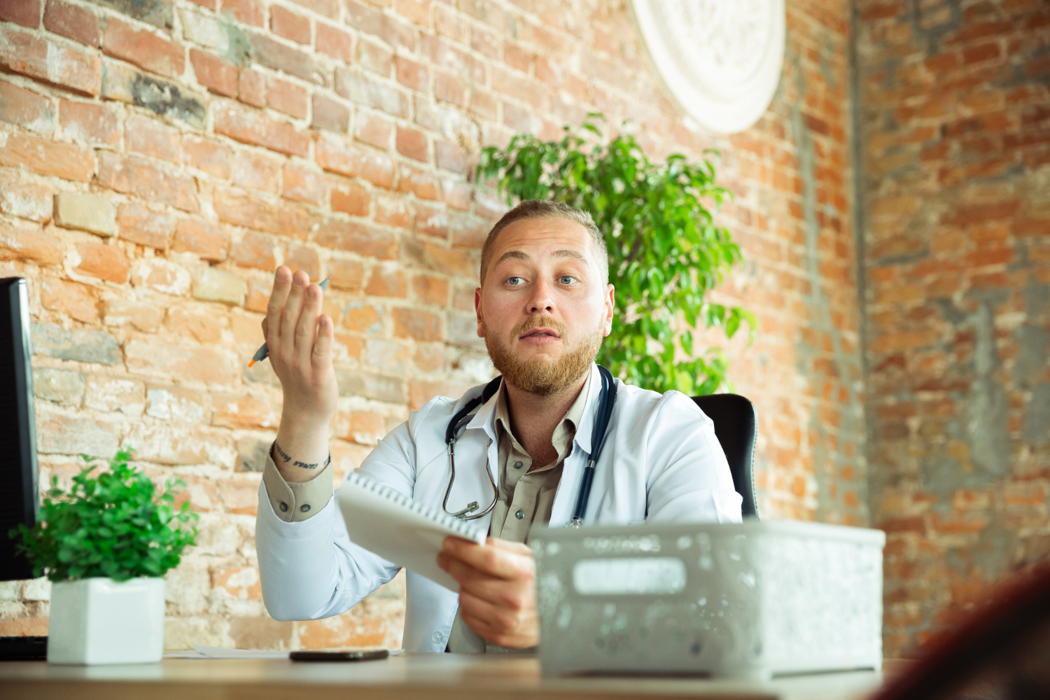 a man sitting at a desk in front of a computer